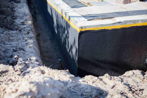 Professional Emergency Waterproofing technician working in Doylestown, WI